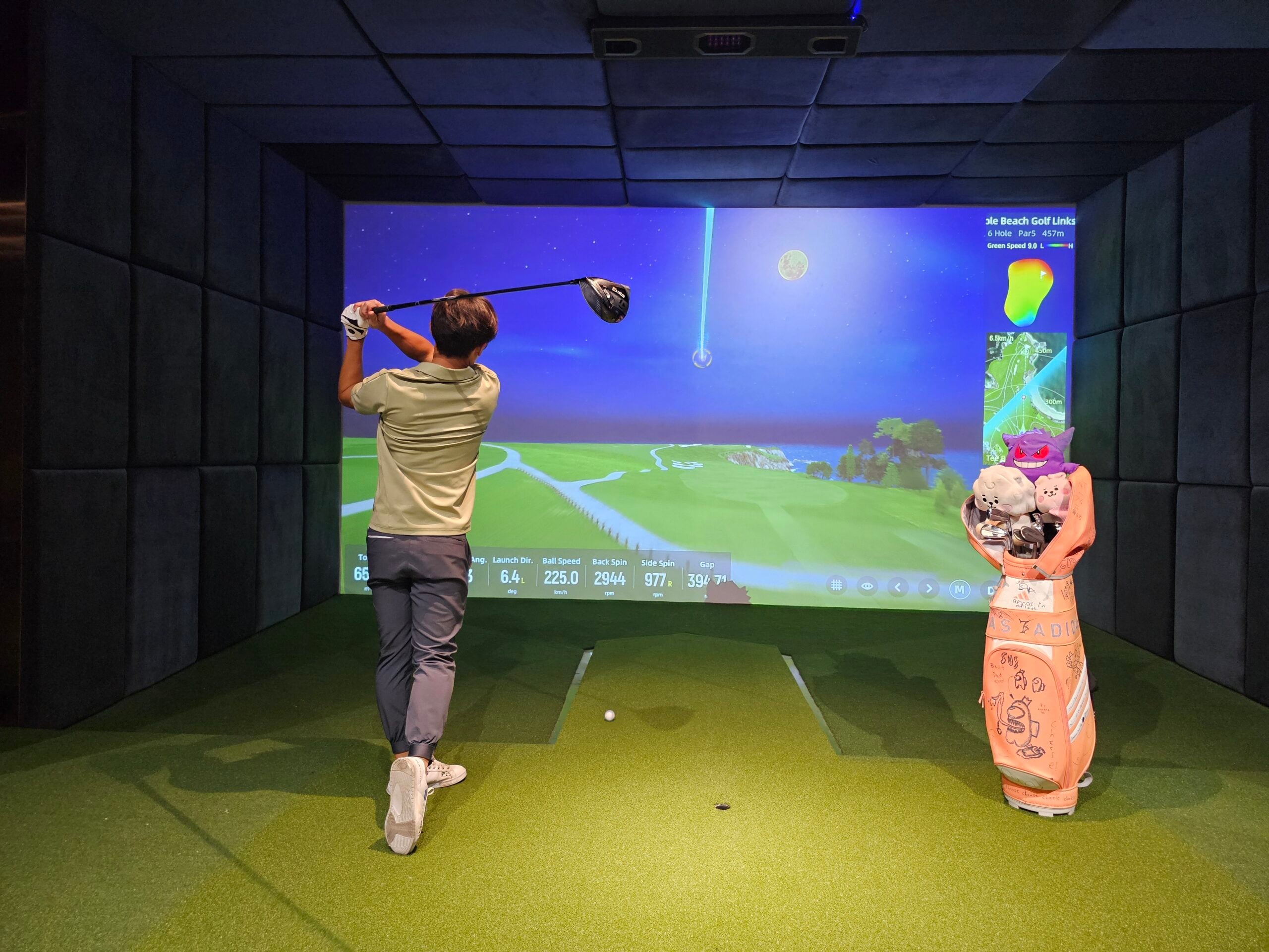 golfer in indoor simulator
