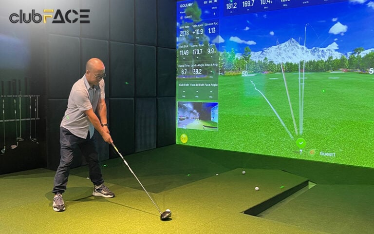 Guys having a fun night out with a golf simulator