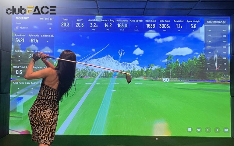 woman using a golf simulator
